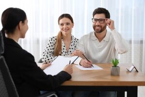 Frisco estate planning attorney reviewing a will and trust with a client